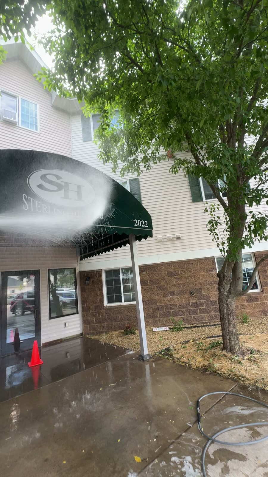 Washing a storefront awning