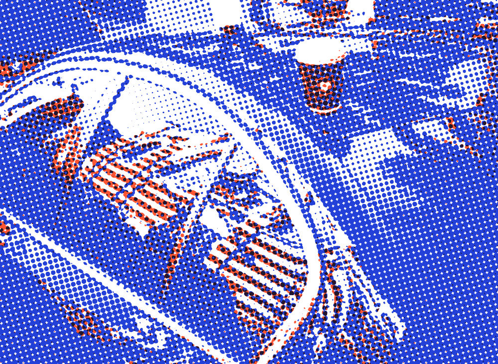 A takeaway coffee cup sitting on the roof of a blue car, printed in orange and blue halftone dots